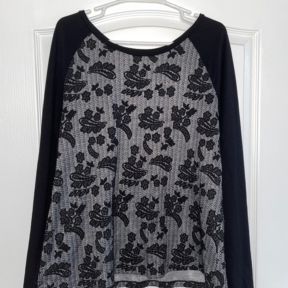 Black and grey long sleeve top with floral accents